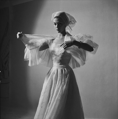 Valentina-Jean-Patchett-in-a-lace-eyelet-head-wrap-and-Valentina-day-dress-with-matching-drawstring-capelette-Vogue-May-1-1952.-Photo-by-Sir-Cecil-Beaton-Courtesy-of-Vogue-and-Conde-Nast